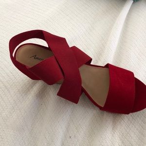 Red platform sandal with suede-like strap.